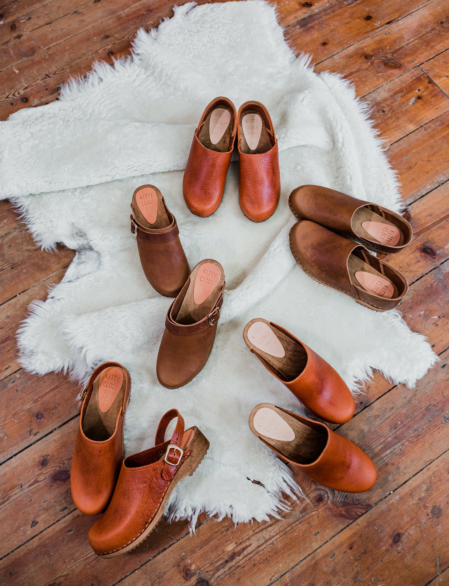 Cumin tan swedish clogs with a low wooden base and covered back