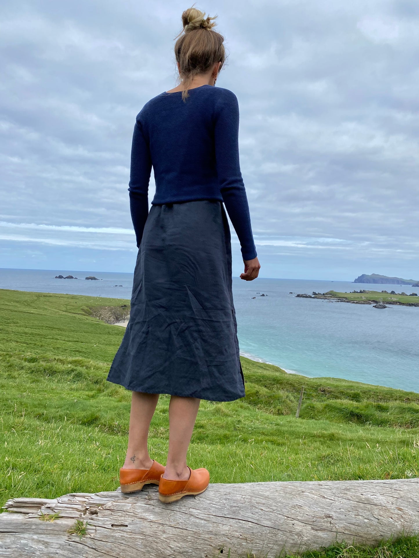 Cumin tan swedish clogs with a low wooden base and covered back