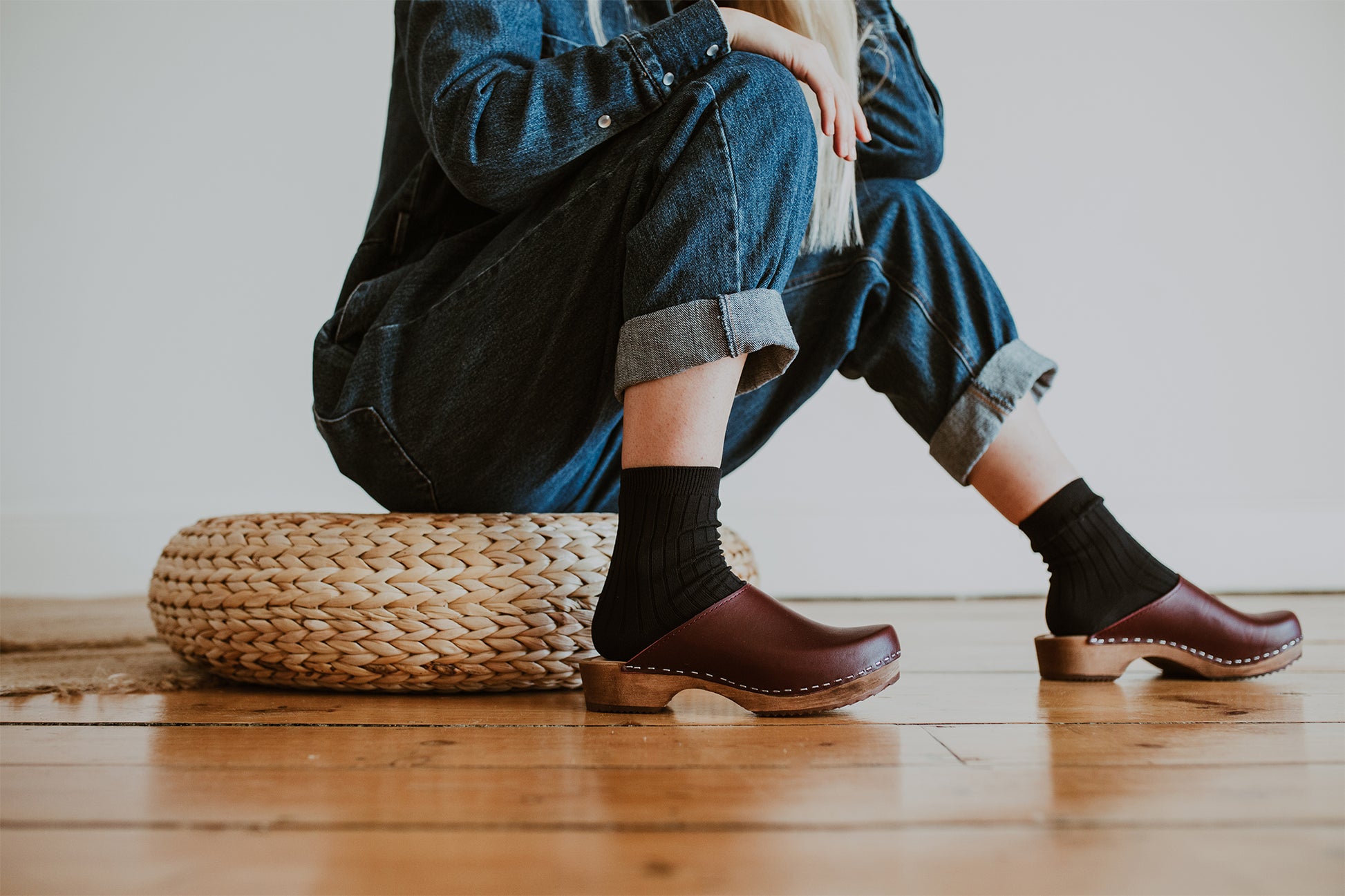 girl wear denim jumpsuit with garnet oxblood classic style swedish clog