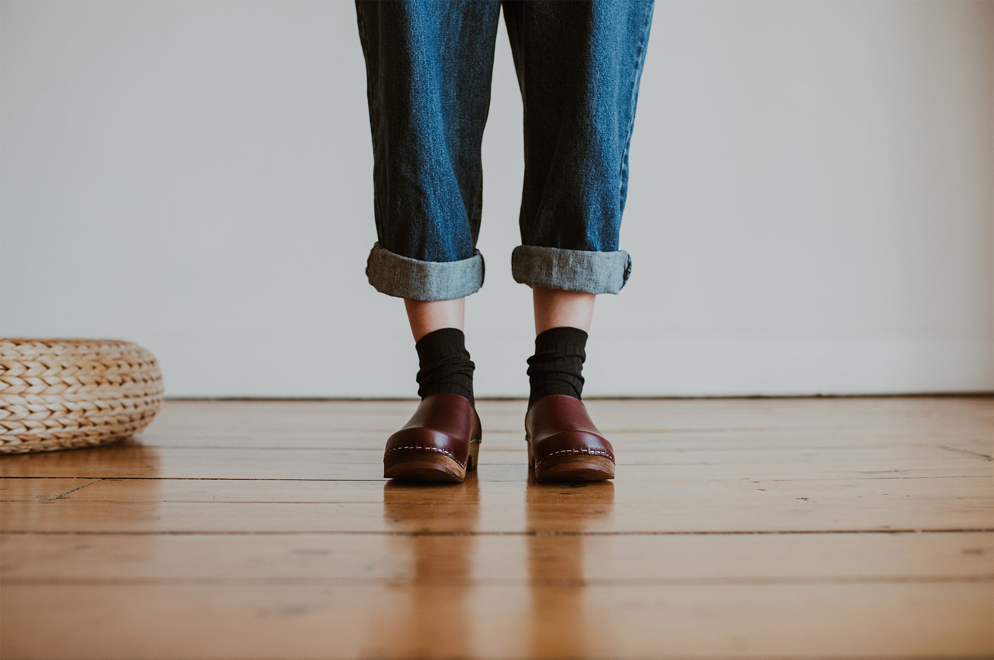 girl wear denim jumpsuit with garnet oxblood classic style swedish clog