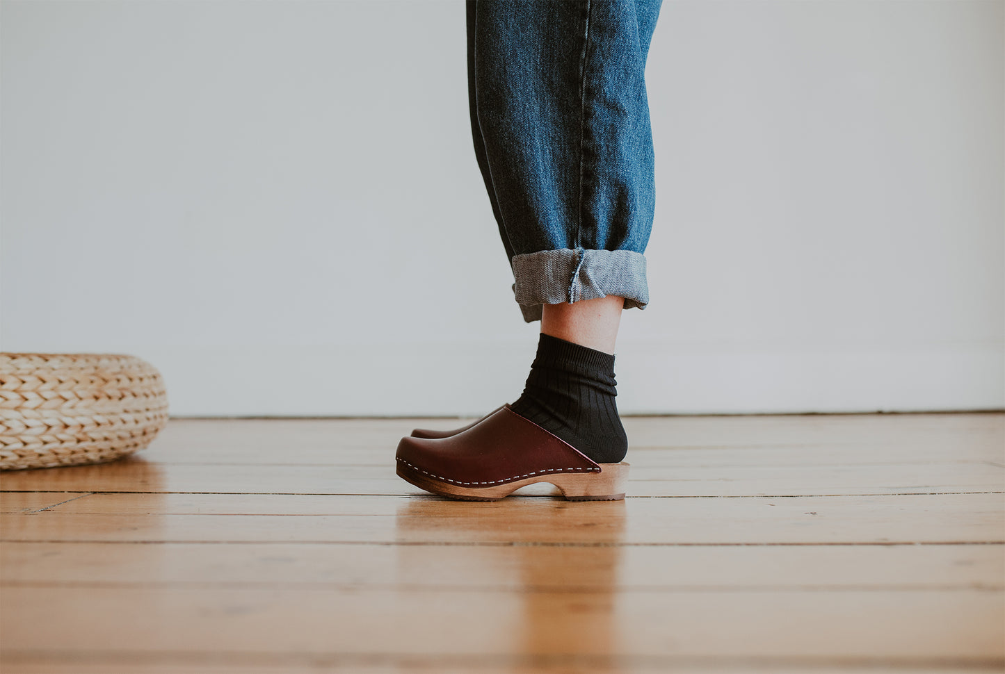 girl wear denim jumpsuit with garnet oxblood classic style swedish clog